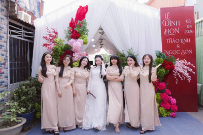 Áo dài bưng quả màu nude đính nơ tay nhúng bồng