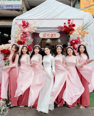 Áo dài bưng quả nữ màu hồng tay loe phối nơ xinh