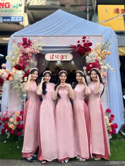 Áo dài bưng quả nữ màu hồng tay loe phối nơ xinh